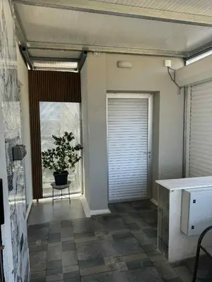 a room with a potted plant and a window at Costas court in Limassol