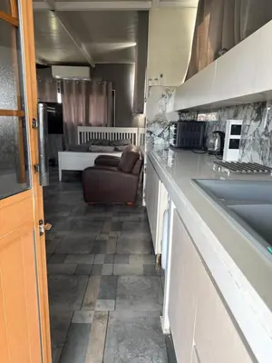 a kitchen with a couch and a living room at Costas court in Limassol