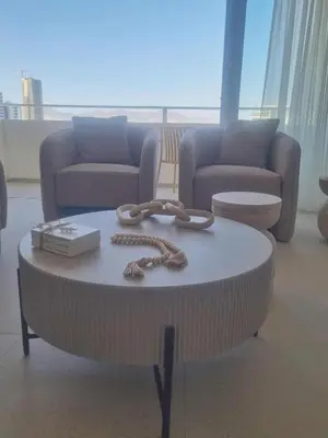 a living room with a table with a rope on it at Karyatis Building in Nicosia