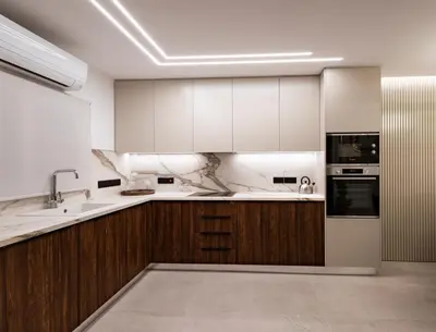a kitchen with white cabinets and a sink at Luxury Marina Beach Stay in Limassol