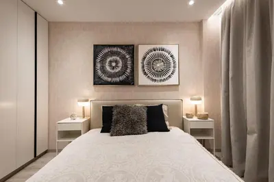 a bedroom with a large bed with two night stands at Luxury Marina Beach Stay in Limassol