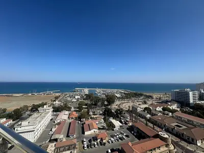an aerial view of a city with the ocean at Stunning Penthouse with Sea and City View in Larnaka