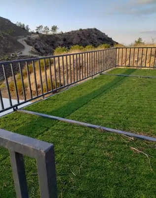 a bench sitting on top of a yard with a fence at Anastasi Tiny Homes- Mountain Views, Garden & Terrace, Pet Friendly in Kakopetria