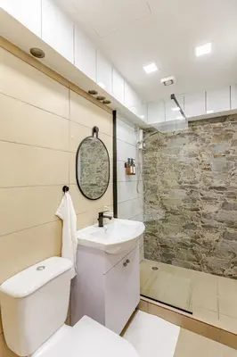 a bathroom with a toilet and a sink and a shower at Kastella Blue Apartment Near Beach in Larnaka