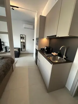 a kitchen with a sink and a counter top at Nesseus Lux Suites - Near Unic & EUC in Ayios Dhometios
