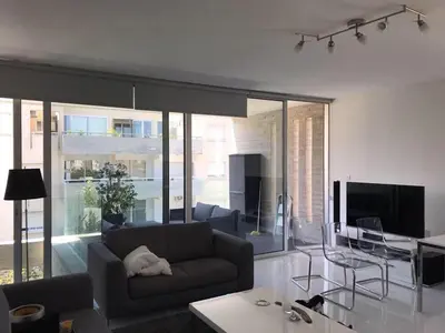 a living room with a couch and a table at Neoptolemou Residences in Nicosia