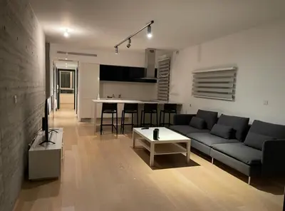 a living room with a couch and a table at Neoptolemou Residences in Nicosia