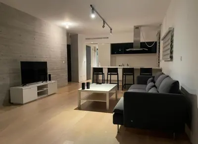 a living room with a couch and a table at Neoptolemou Residences in Nicosia