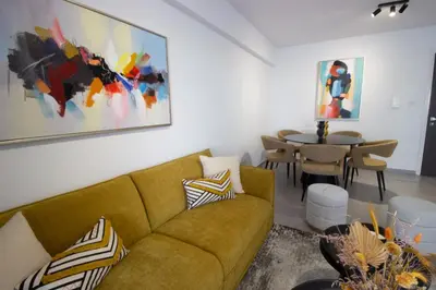a living room with a couch and a table at Modern City Retreat - Balcony and Chic Design in Nicosia