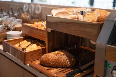 a bakery with bread and other baked goods on display at Warner Boutique Hotel-Adults Only in Larnaka