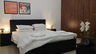 a bedroom with a bed with two towels on it at Skoufa 21 - Luxury Apartment -Breakbooking CY in Limassol