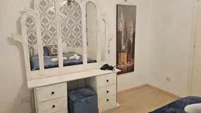 a bedroom with a bed in a white dresser at STAY Alex's House in Strovolos