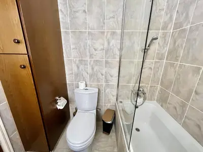 a bathroom with a toilet and a shower and a tub at STAY Paradise Apartment in Protaras