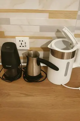 a kitchen counter with a coffee maker and a blender at Alasia Apt-2Bdr in Nicosia