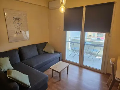 a living room with a couch and a table at Alasia Apt-2Bdr in Nicosia