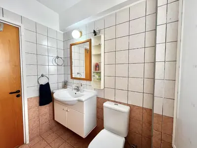 a bathroom with a toilet and a sink at STAY Agapi Sea view Villa in Pissouri