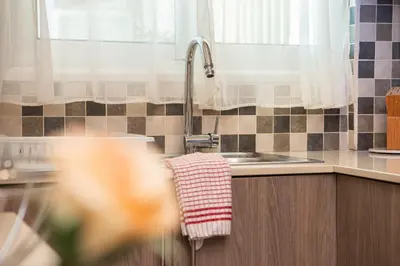 a kitchen with a sink and a towel at Bluewave Apartment in Pyla