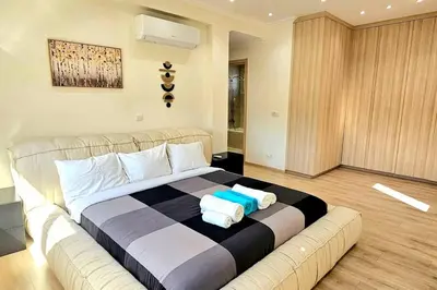 a bedroom with a large bed with towels on it at Pareklisia Mystical Haven in Parekklisha