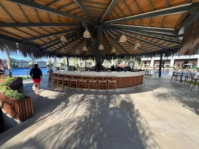a patio with a bar with chairs and a table at Grand Sapphire,Luxury Residence BY Report Homes Northern Cyprus in Ayia Napa