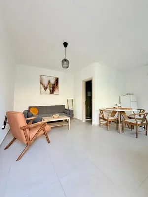 a living room with a couch and a table at Kiti Traditional Residences in Larnaka