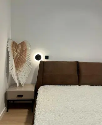 a bed with a heart pillow on the wall at Sweet Luxury 2BR Nicosia City in Nicosia