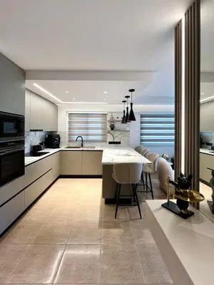 a kitchen with a table and some chairs in it at Sweet Luxury 2BR Nicosia City in Nicosia