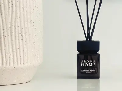 a bottle of aroma home with sticks in it at Grace Living in Limassol