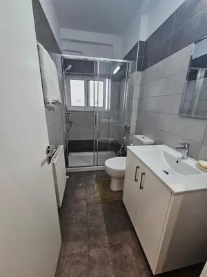 a bathroom with a shower and a toilet and a sink at 3 bedroom villa in Voroklini