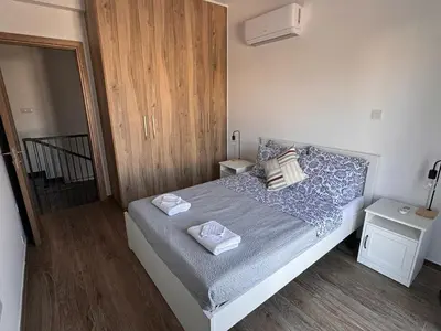 a bedroom with a bed with two pillows on it at Villa - Sleeps 6 - Near Local Attractions in Limassol