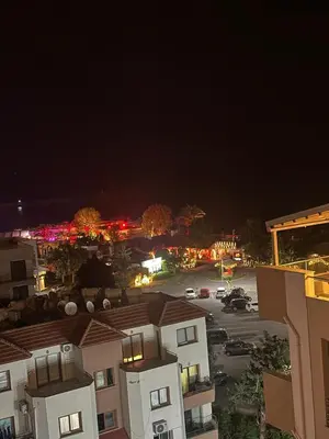 a view of a city at night with buildings at Moonlight Home in Nicosia