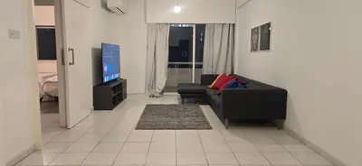 a living room with a black couch and a flat screen tv at Executive 2BR Spacious Apartment , Limassol Center, 2 Balconies, Ideal Business Stay - SuperCentro! in Limassol
