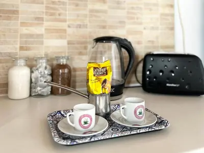 a tray with two cups of coffee on a counter at Charming 1-BR Stay Near City Centre, Marina and Beaches - Perfect for Couples, Business or Solo Travellers in Limassol