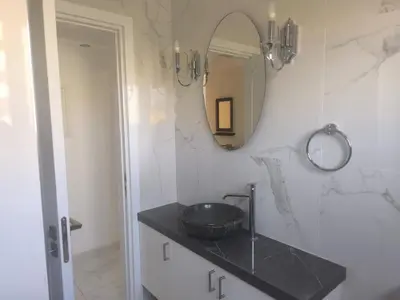 a bathroom with a sink and a mirror at Lux studio apartment in Limassol