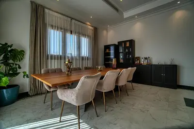 a dining room with a wooden table and chairs at Cyprus Sunbay Retreat in Ayia Napa