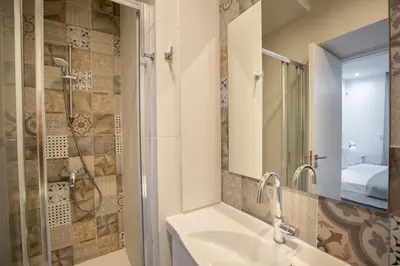 a bathroom with a sink and a shower at Two Bedroom House In Town Center by Sweet Keys in Limassol