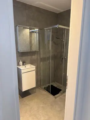 a bathroom with a shower and a sink at Modern Marvel Seaview in Paralimni