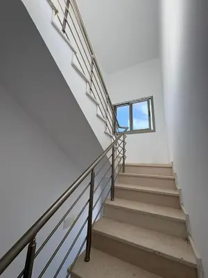 a staircase in a house with a window at Lapta Yellow 1 bedroom in Limassol
