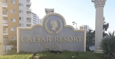 a sign for a caserar resort and spa at Апартаменты Студия in Dherinia