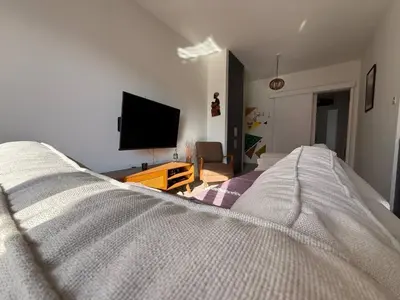 a bedroom with a bed and a flat screen tv at Central Nicosia Haven in Nicosia