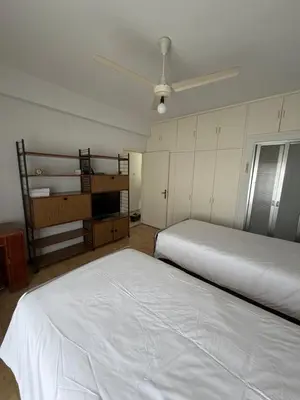 a bedroom with two beds and a bunk bed at Ellados in Strovolos