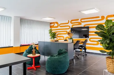 an office with two chairs and a desk and a table at Local Host Living - Signature Apartments in Nicosia in Nicosia