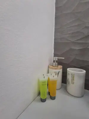 two cups sitting on a counter next to a sink at Lazuli City Center Studio 161 - 100 m from the beach in Larnaka