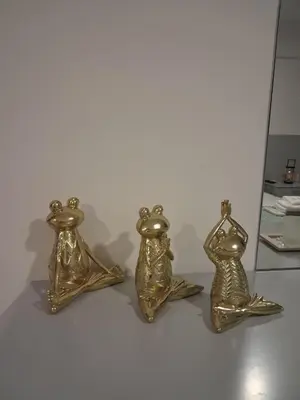 three gold candlesticks are sitting on a table at Lazuli City Center Studio 161 - 100 m from the beach in Larnaka