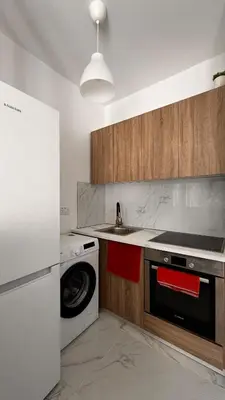 a kitchen with a washing machine and a sink at Seaside Studio in Limassol