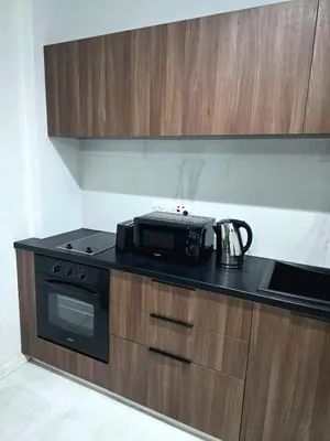 a kitchen with a microwave on a counter top at 5mins from the beach,10mins from LC airport Aurelia Suite in Larnaka