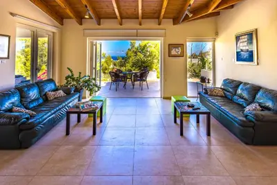 a large living room with couches and a table at Marina Heights Villa in Protaras