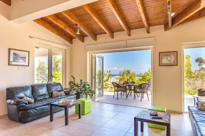 a living room with a couch and a table at Marina Heights Villa in Protaras