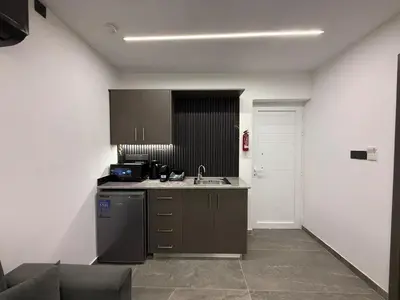 a kitchen with a sink and a counter top at Onar Exclusive Studio Suite in Voroklini