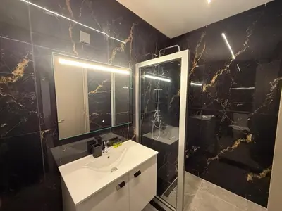 a bathroom with a sink and a mirror at Onar Exclusive Studio Suite in Voroklini