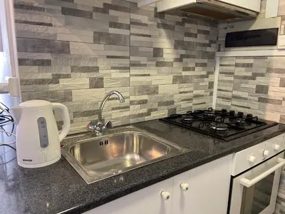 a kitchen with a sink and a stove at Archangelos Studio in Strovolos